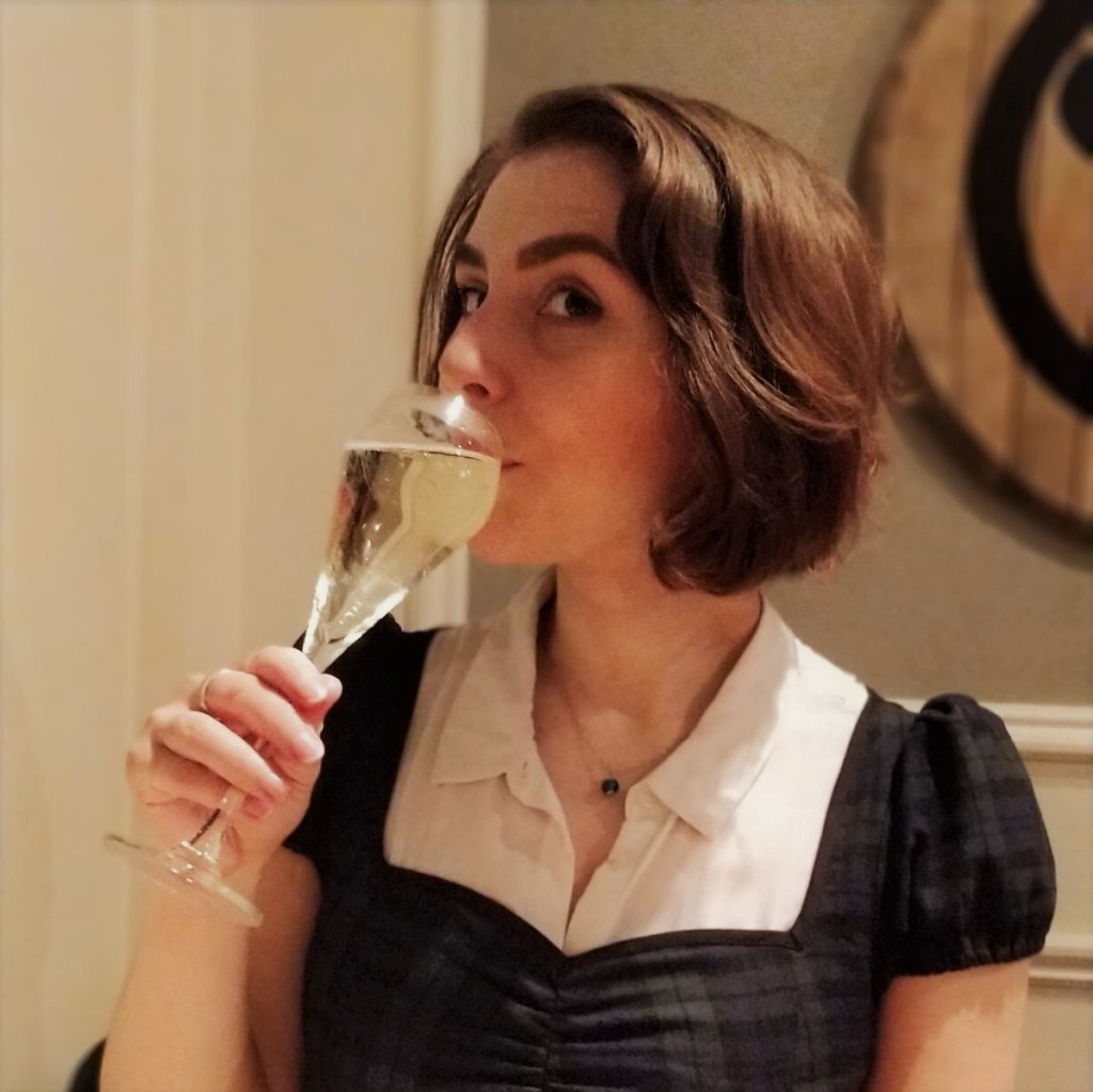 Rebecca sipping sparkling sake in London, 2018